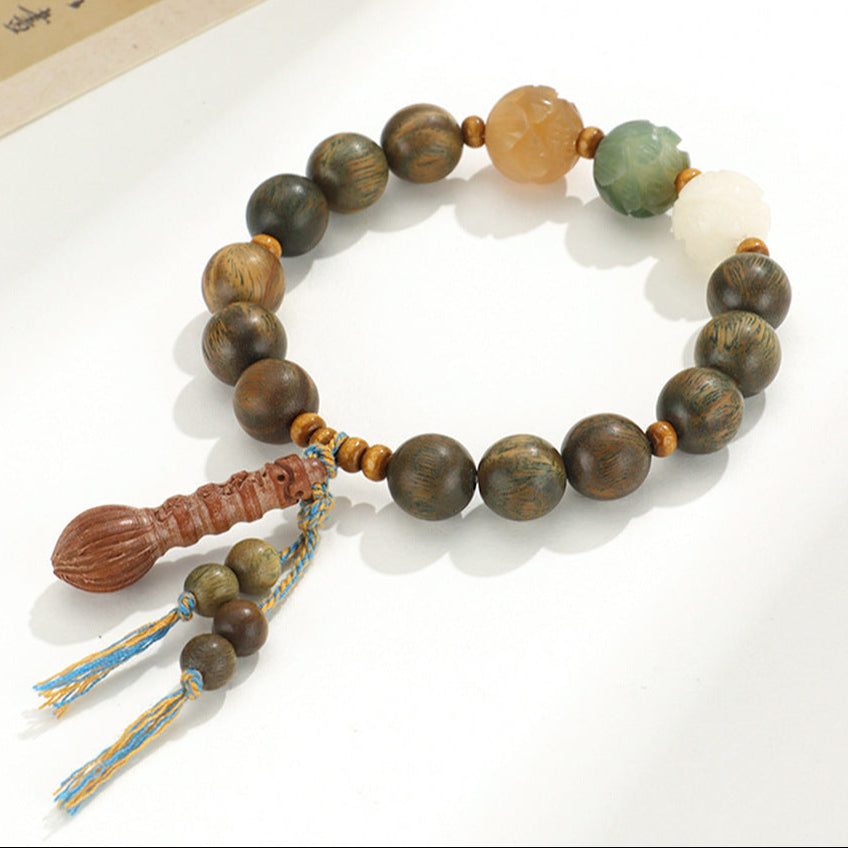 Large Bead Green Sandalwood Bracelet with Lotus Carvings & Tassel – Spiritual Renewal