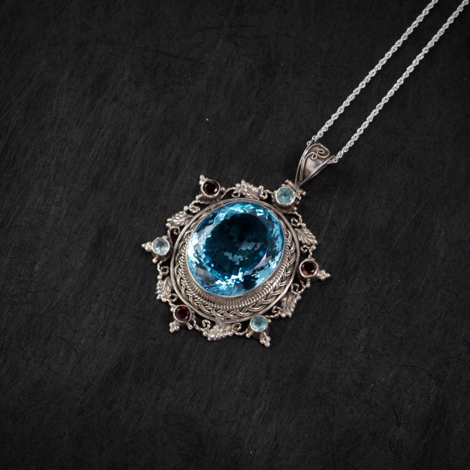 Blue Topaz Starburst Silver Pendant – Clarity & Expression