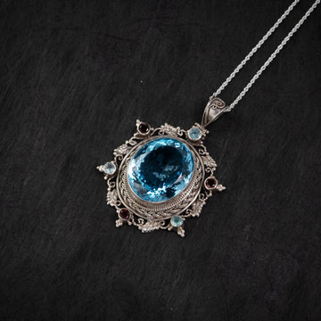 Blue Topaz Starburst Silver Pendant – Clarity & Expression