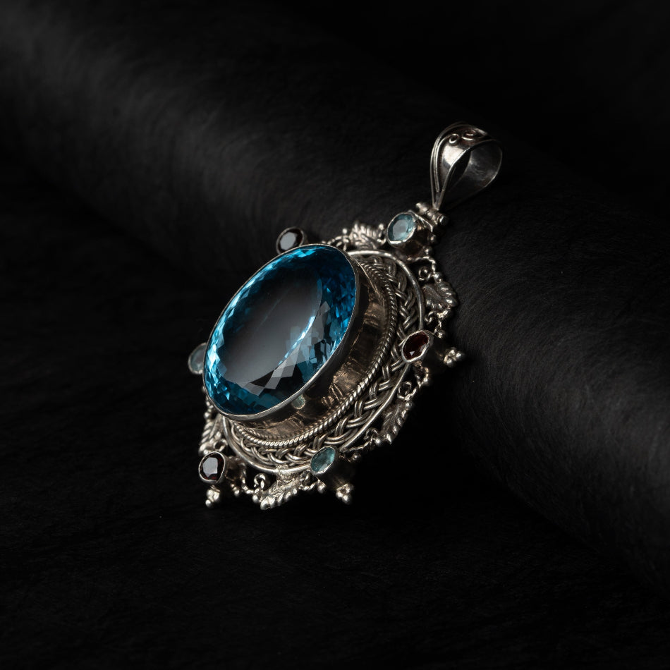 Blue Topaz Starburst Silver Pendant – Clarity & Expression
